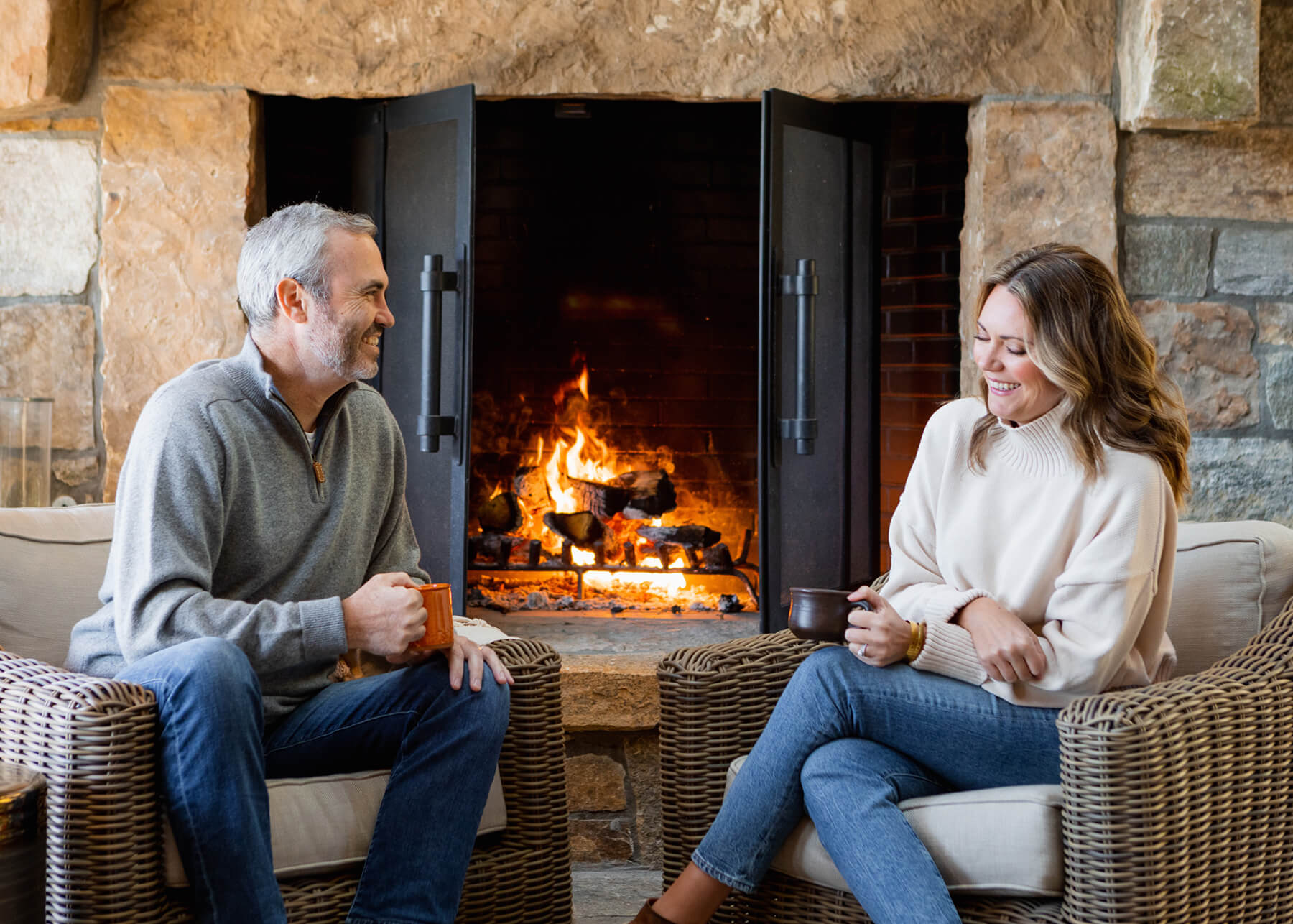 Couple by a cozy fireplace