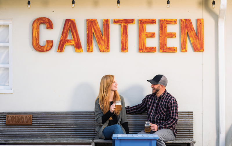 Couple having drinks at Cedar Mountain Canteen.