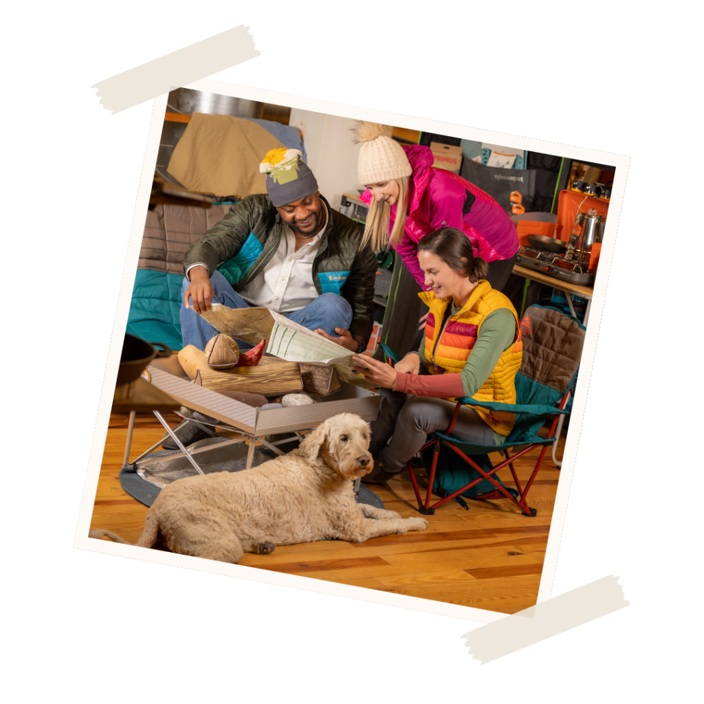 Winnie, D.D. Bullwinkel's shop dog posing in the store with shoppers in Downtown Brevard